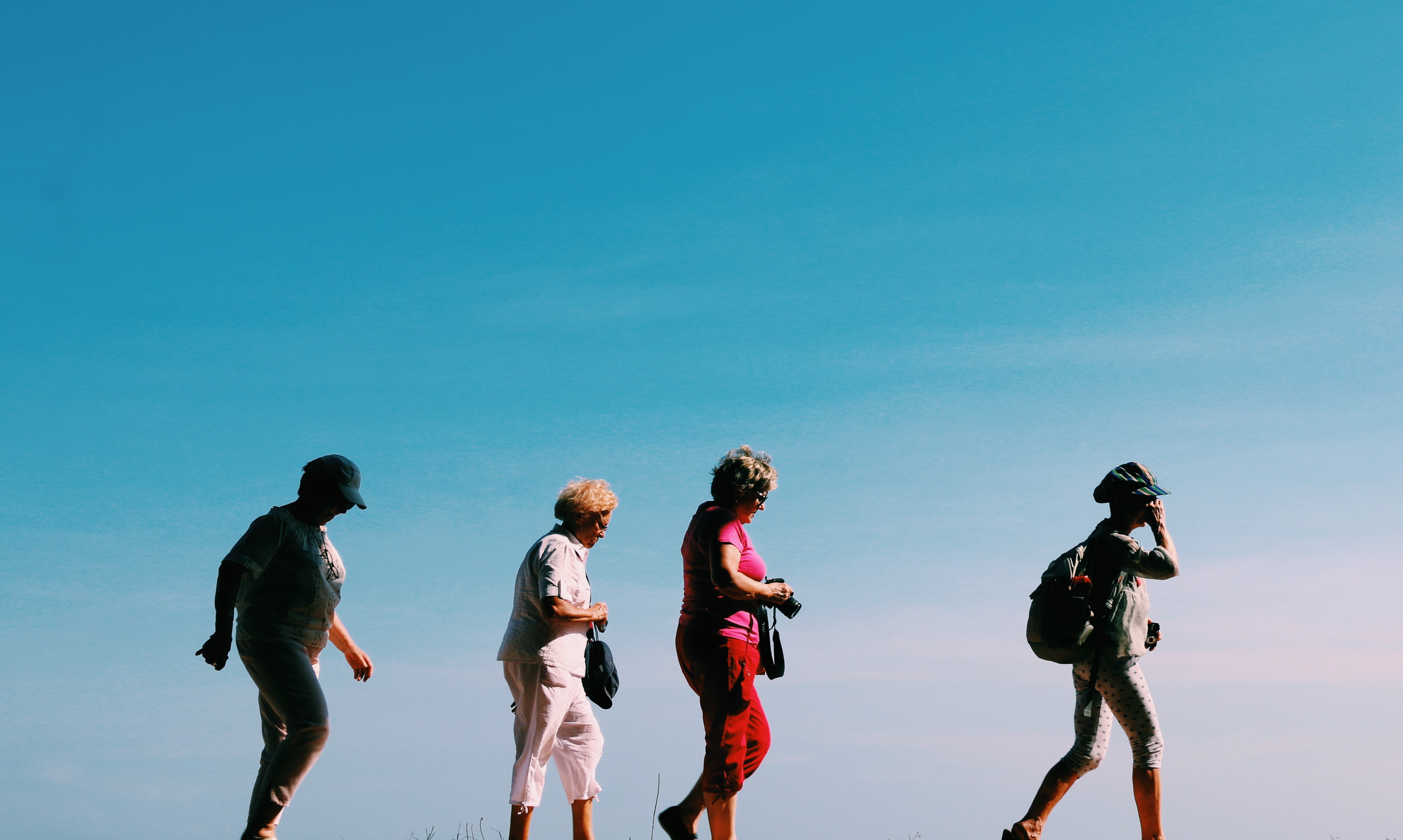 Four Elderly People Hiking